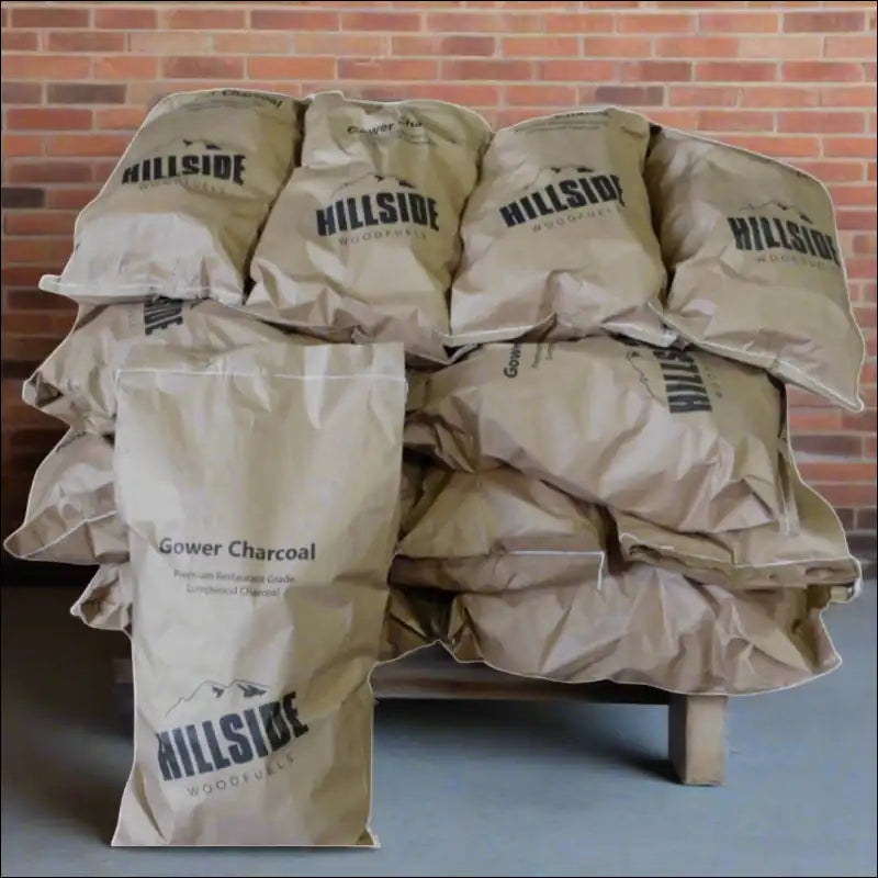 2kg Wholesale Bags Of Restaurant Grade Lump Charcoal On a Table For Sale