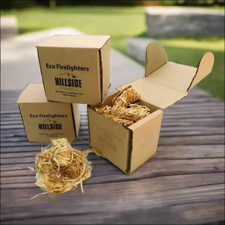 Natural Wood Wool Firelighters Pack Of 40 With Shredded Paper Boxes On Wooden Table