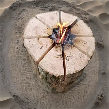 Swedish Torch: Circular Ash Wood Log With Radial Cuts, Small Fire In Center, High Heat Output