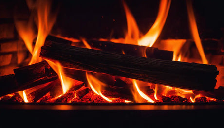 Burning logs in a fireplace with vibrant orange flames for cozy fires and heating efficiency