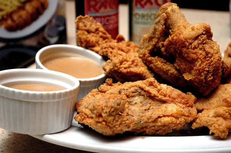 Crispy Golden-brown Fried Chicken Pieces Served With Dipping Sauces On a Plate.