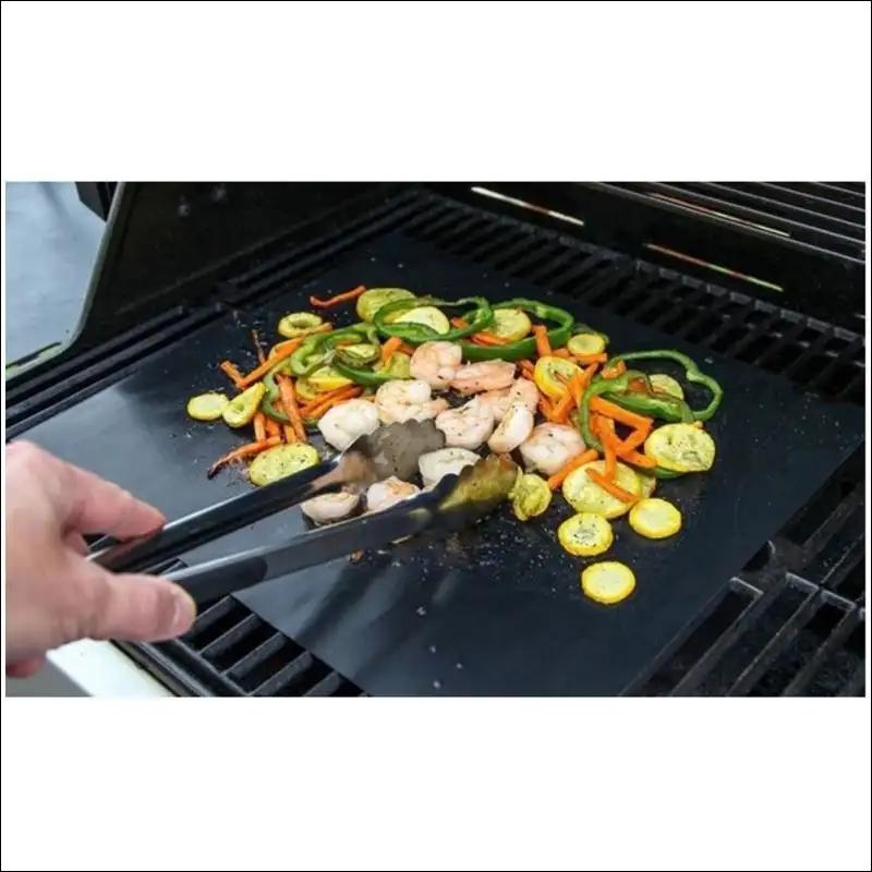 Person Cooking Vegetables On Bbq Using 5pc Non-stick Bbq Grill Mat