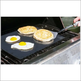 Two Eggs Cooking On Bbq Grill Mat, Showcasing Non-stick, Reusable Feature