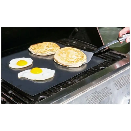 Two Eggs Cooking On Bbq Grill Mat, Showcasing Non-stick, Reusable Feature