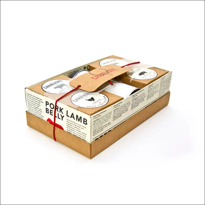 Carnivore Club Bbq Spice Set In Box Tied With Red Ribbon On Kiln Dried Wood Fuels