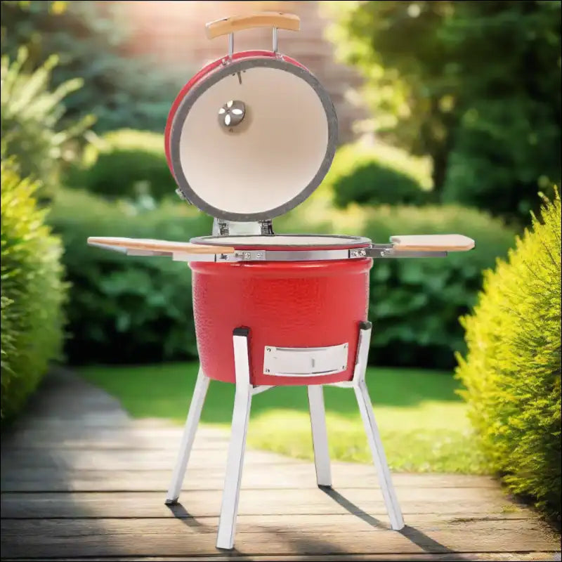 Kamado Barbecue Grill Smoker In Red And White On Wooden Deck