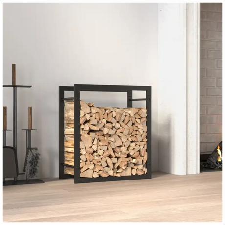 Matt Black Steel Firewood Rack Beside a Cozy Fireplace With Logs In It