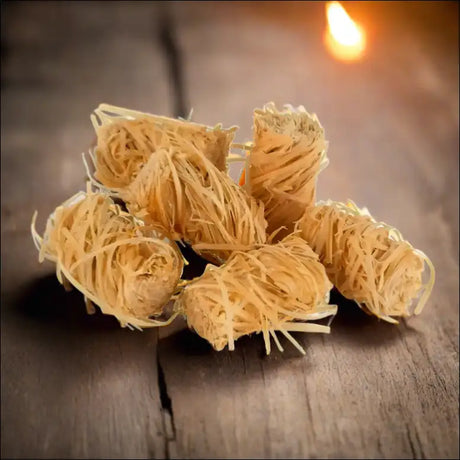 Close-up Of Wood Wool Firelighters Resembling Noodles On a Table