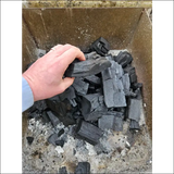 A Hand Picking Lumpwood Charcoal From a 6kg Restaurant Grade Charcoal Bag