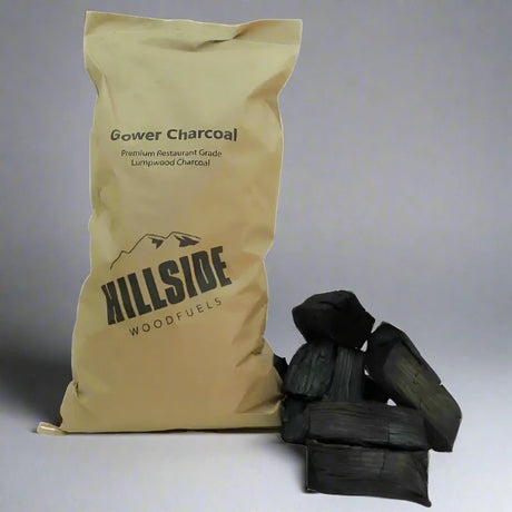 Restaurant Grade Lumpwood Charcoal Small Bag 2kg Next To Another Bag Of Grade Lumpwood Charcoal