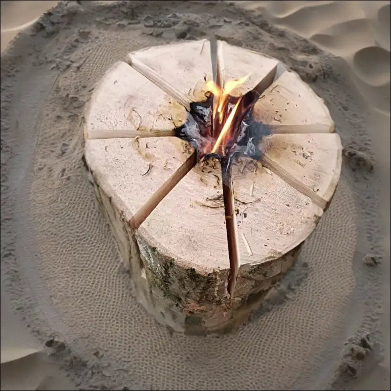 Swedish Torch: Circular Ash Wood Log With Radial Cuts, Small Fire In Center, High Heat Output